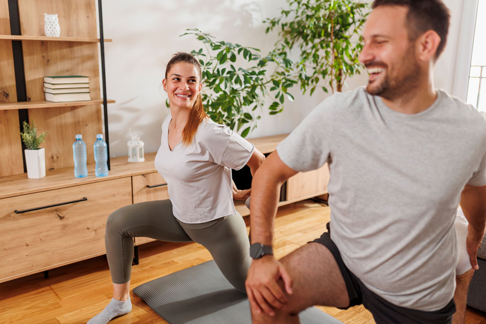 couple-working-out-together-at-home-optimized